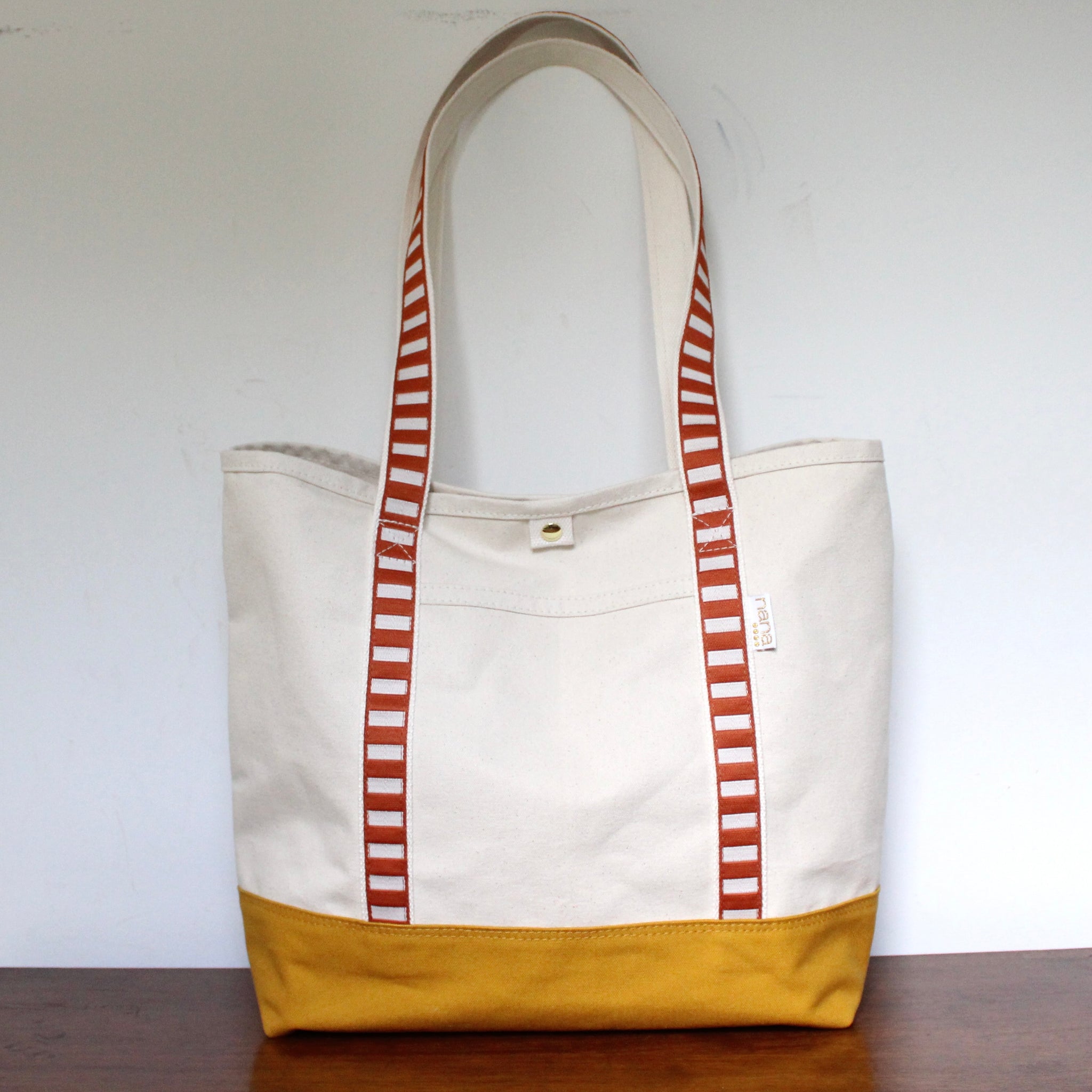 canvas travel tote: saddle + off white strap
