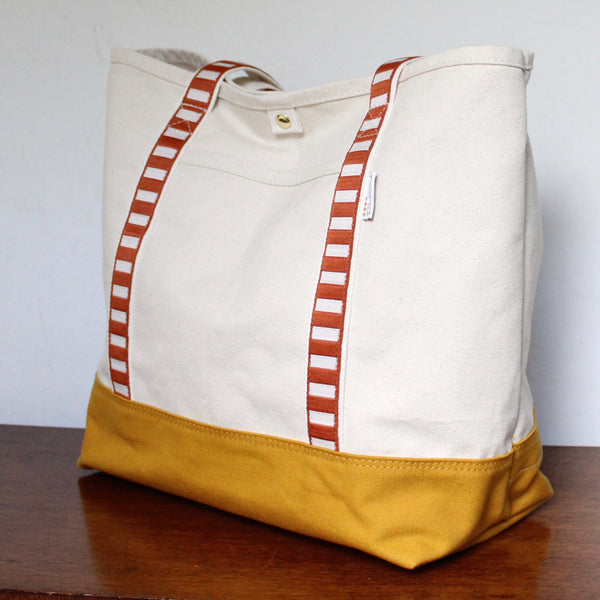 canvas travel tote: saddle + off white strap